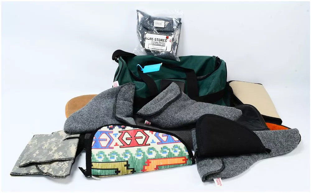 A Collection of Bore-Stores Silicone Treated Gun Storage Cases and a Duffel Bag