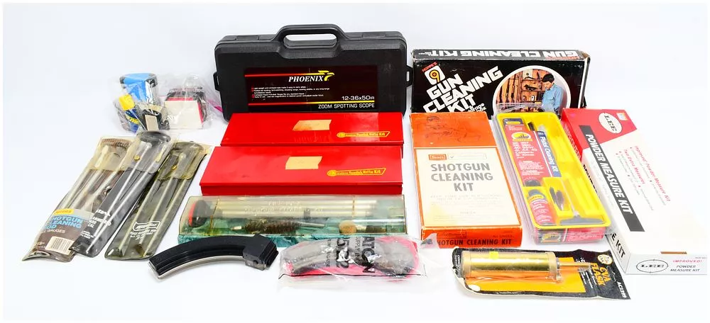 A Collection of Firearm Maintenance, Cleaning, Reloading, and Optical Accessories by Phoenix, Hoppe's, Outers, LEE, and Sears