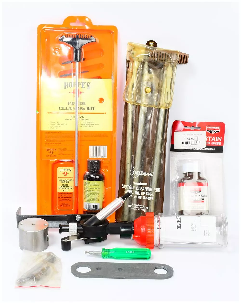 A Collection of Hoppe's Pistol Cleaning Kit, Outers Shotgun Rod, and Reloading Supplies