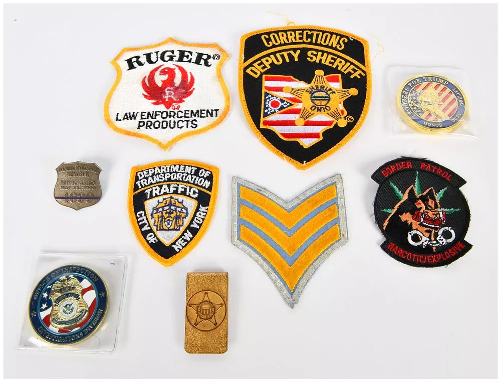 A Collection of Modern Law Enforcement, Security, and Commemorative Memorabilia, including Patches and Challenge Coins
