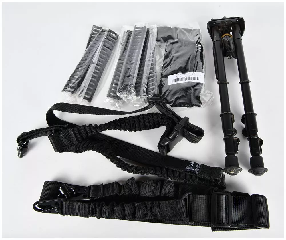 A Collection of Tactical Firearm Accessories, including an Adjustable Bipod, CAA Sling, and AR-15 Brass Catcher