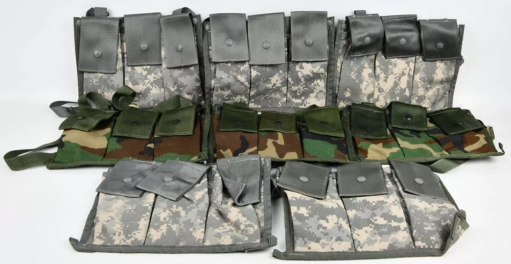 A Collection of USGI Military MOLLE II 6 Magazine Bandoleer Ammunition Pouches in UCP and Woodland Camouflage
