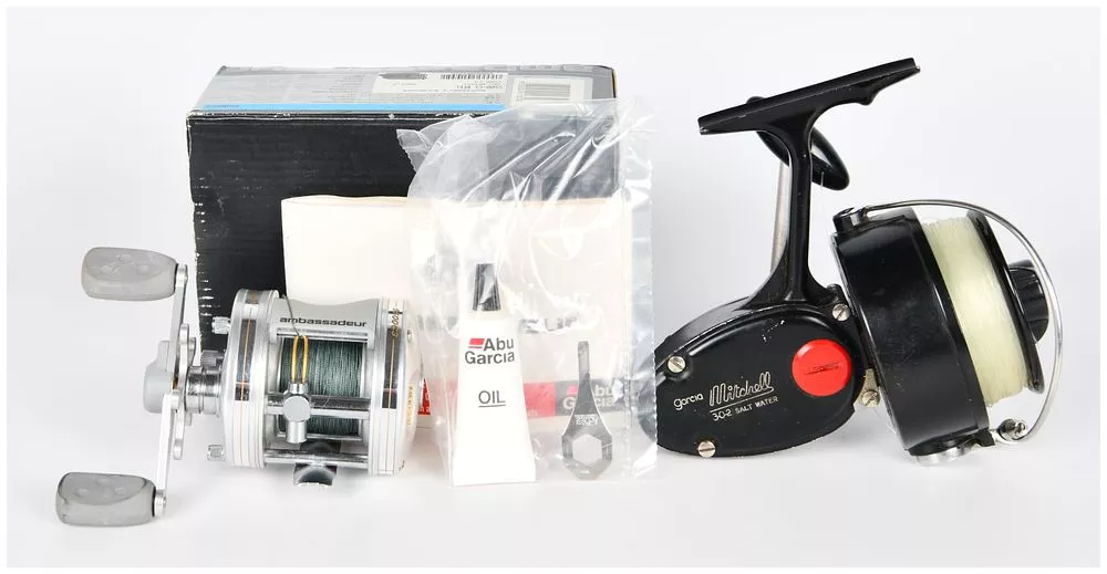 A Garcia Mitchell 302 Saltwater Spinning Reel and an Abu Garcia Ambassadeur 5500C3 Baitcasting Reel