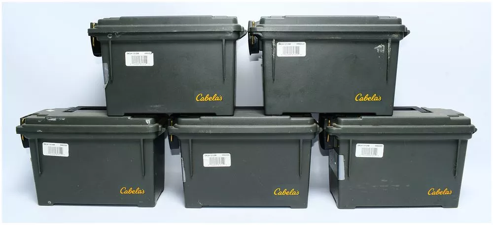 A Group of Five Cabela's and Academy SPORTS+OUTDOORS Dry-Storage Ammo Boxes