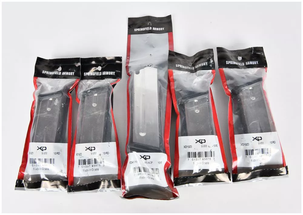 A Group of Five Springfield Armory XD Magazines, Four 9mm 10-Round and One .45 ACP 10-Round