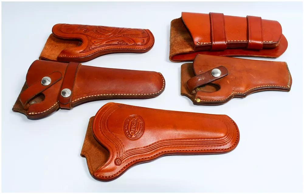 A Group of Five Western-Style Leather Gun Holsters, including one by Hilda, Arizona