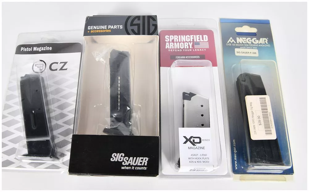 A Group of Four New Pistol Magazines by CZ, Sig Sauer, Springfield Armory, and Mec-Gar