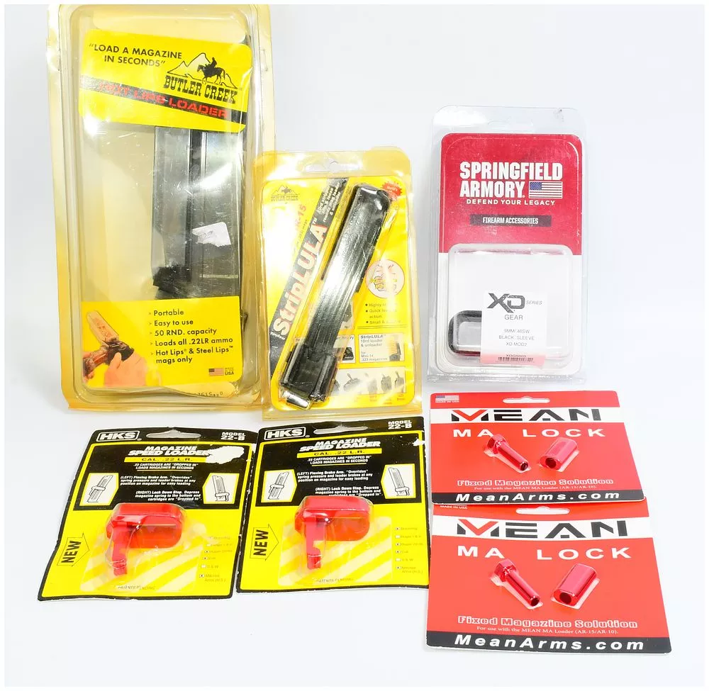 A Group of Six Firearm Accessories, including a Maglula M-16/AR-15 StripLULA Loader and a Butler Creek Hot Lips Loader