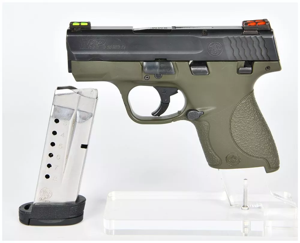 A Smith & Wesson M&P 9 SHIELD 9mm Semi-Automatic Pistol with OD Green Frame and Fiber Optic Sights