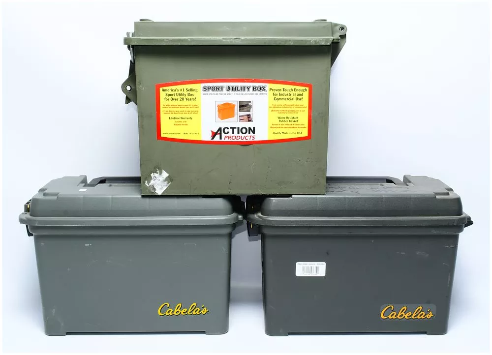Three Large Size MTM Sport Utility Dry Boxes, including Action Products and Cabela's branded examples
