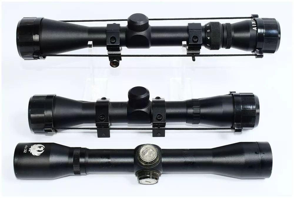 Three Modern Black-Finished Rifle Scopes, including AIM and Ruger