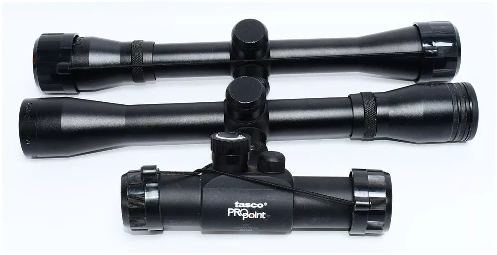 Three Modern Optical Sighting Devices: A Tasco Red Dot Sight and Two Gamo Rifle Scopes