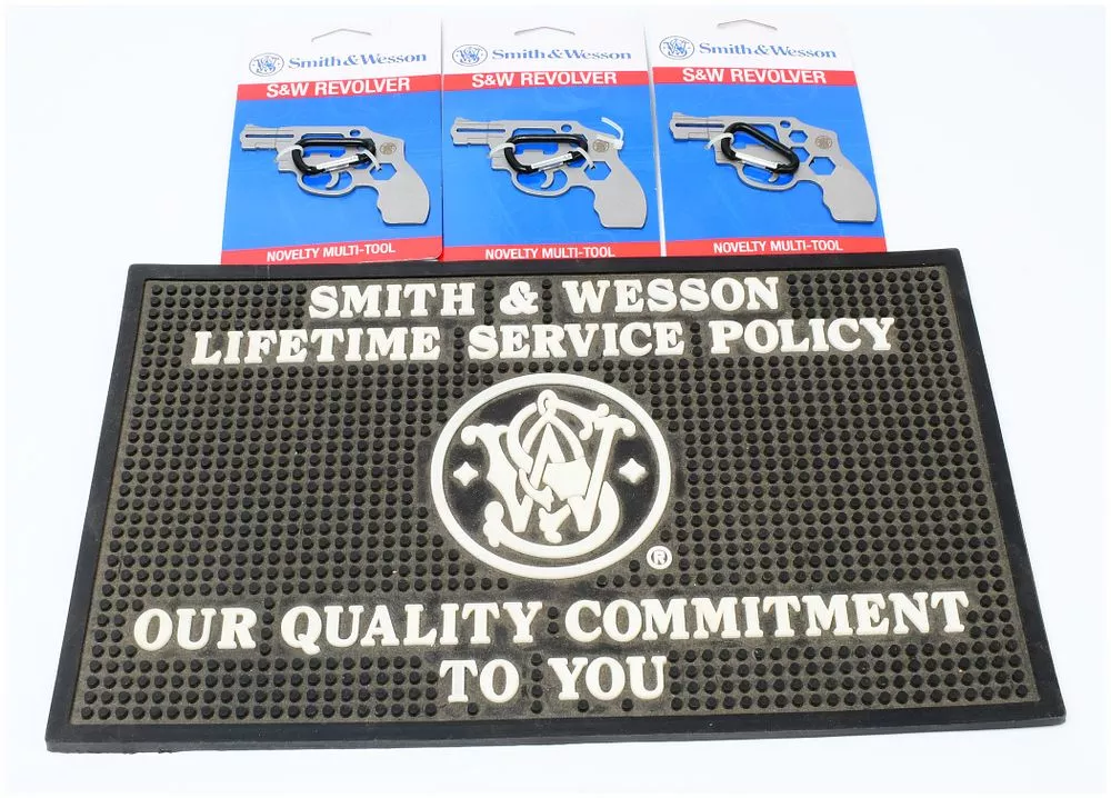 Three Smith & Wesson S&W Revolver Novelty Multi-Tools and a Smith & Wesson Lifetime Service Policy Rubber Counter Mat